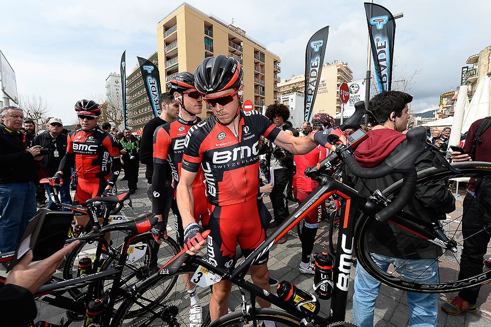 Rohan Dennis grabs his bike.