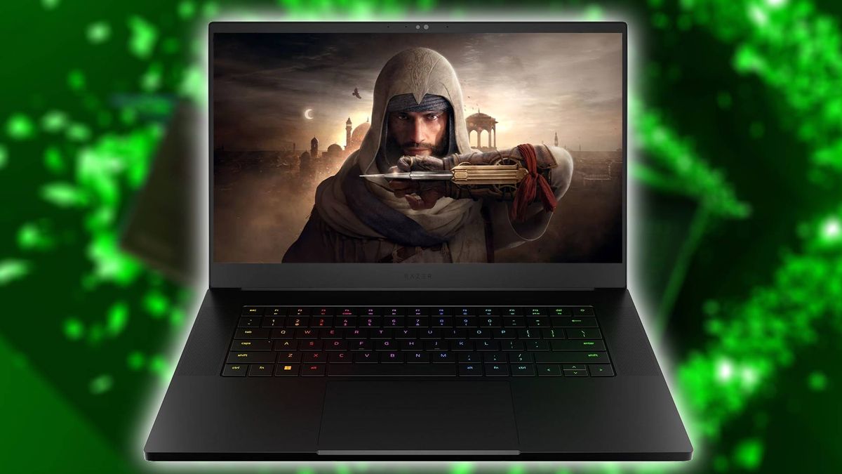 Razer Blade 15 laptop with Assassin&#039;s Creed: Mirage art on screen and green backdrop