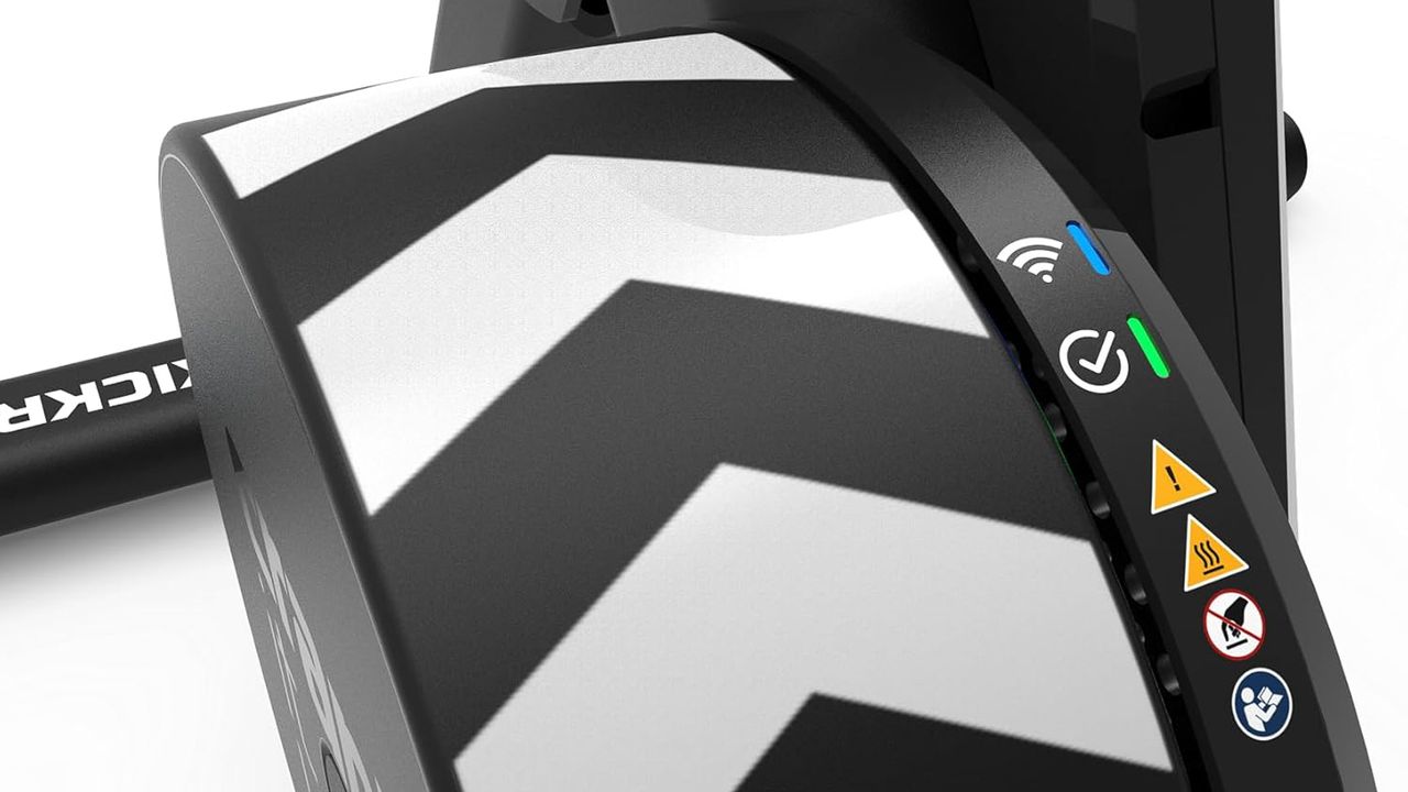 Close-up details of the Wahoo Kickr Core 2 flywheel showing LED connectivity lights