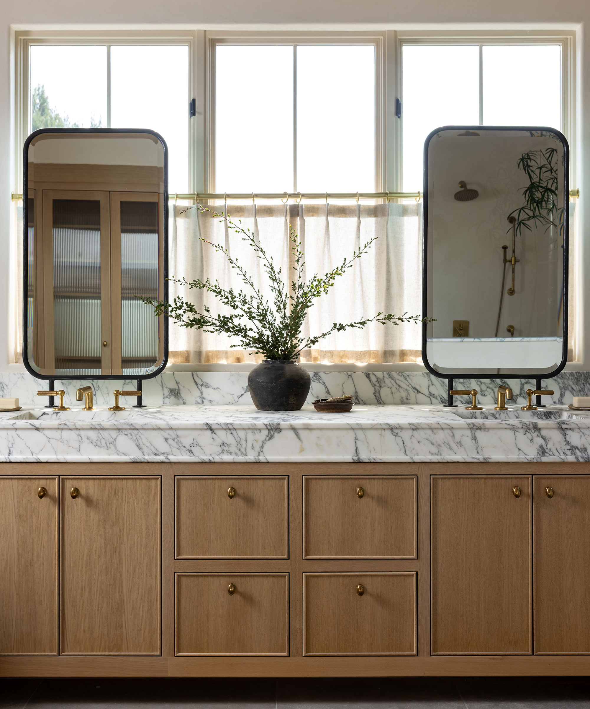 wooden bathroom vanity unit with marble countertop and twin basins