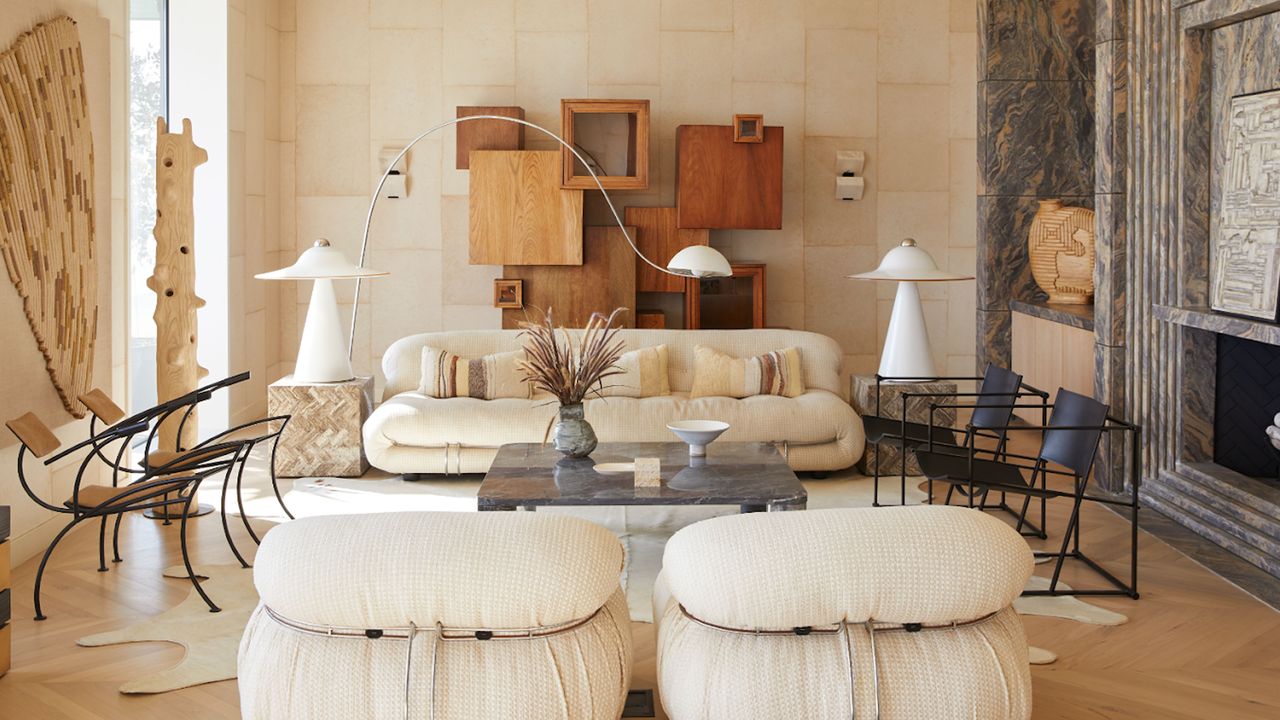 a beige living room with maximalist decor and beige sofas