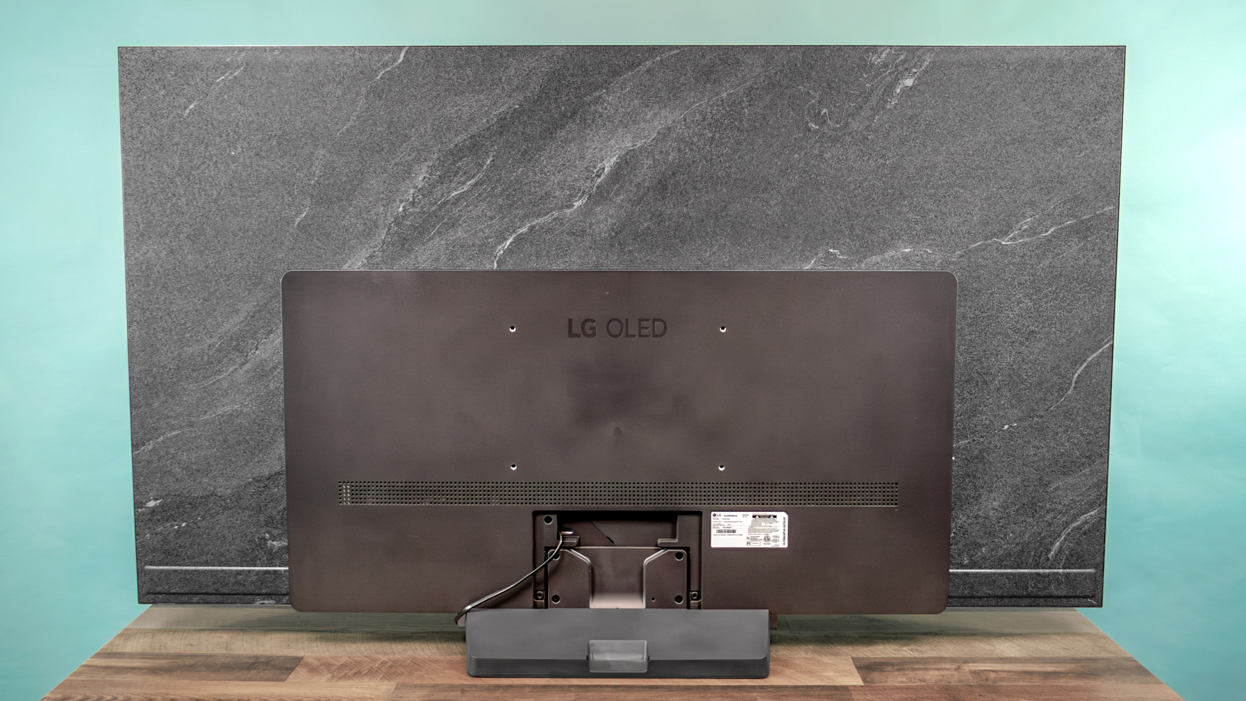 LG C6 OLED TV shown on a wood table