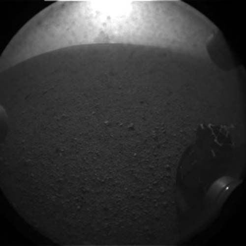 This photo shows the one of the six wheels of NASA&#039;s huge rover Curiosity on Mars just after the rover&#039;s Aug. 5 PDT, 2012 landing in Gale Crater