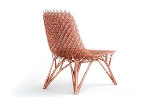 An intricate chair covered with copper for strength