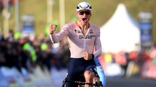 Mathieu van der Poel punches the air as he wins the cyclocross world championships