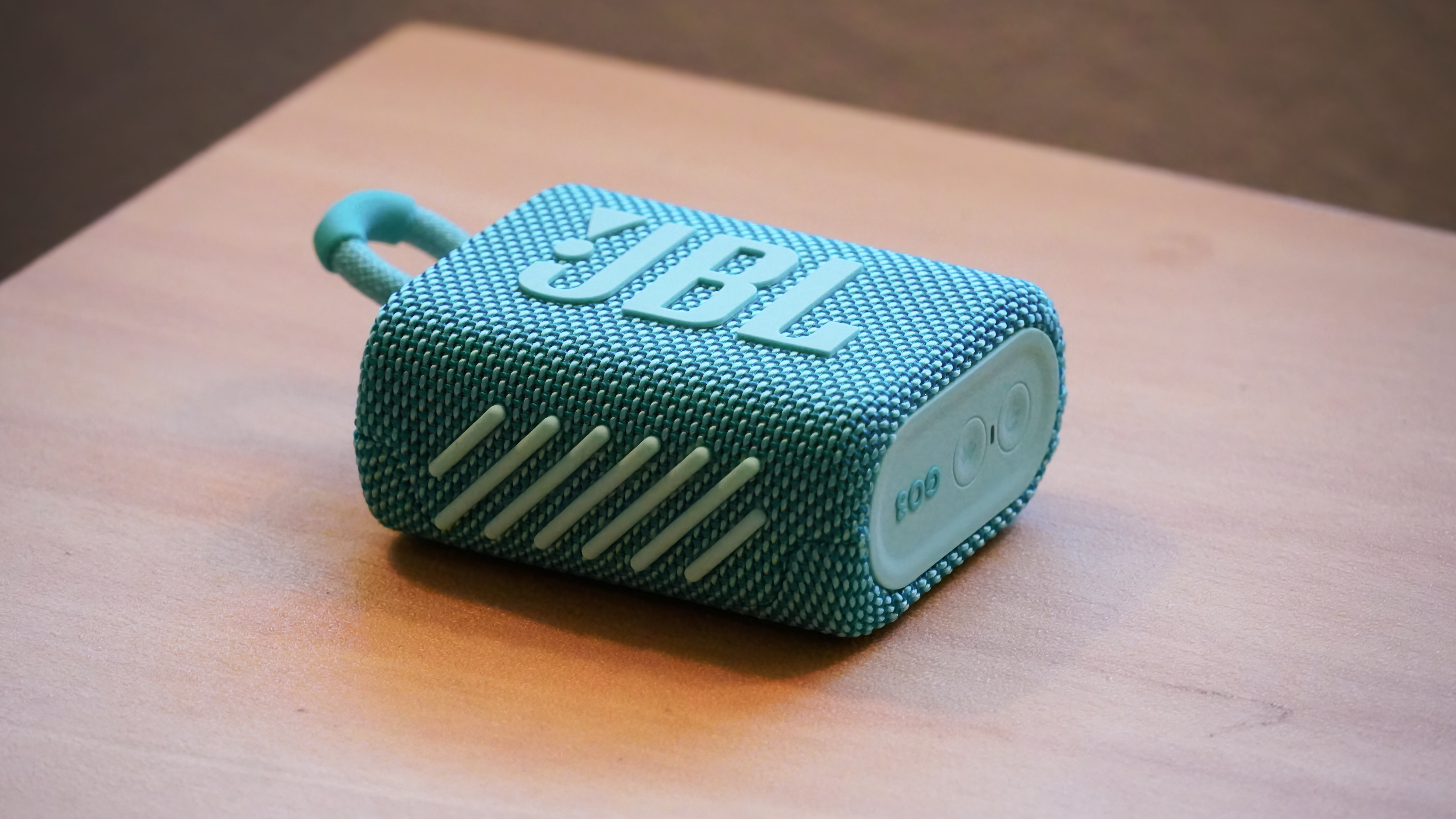 The JBL Go 3 speaker on a drum.