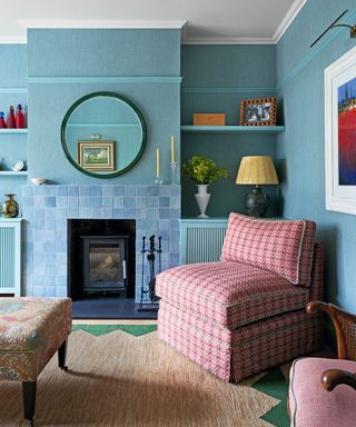 Blue living room with pink chair