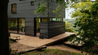 contemporary timber cladding and wraparound deck