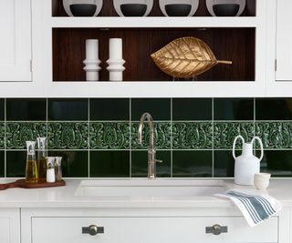 Green tile backsplash, white cabinets