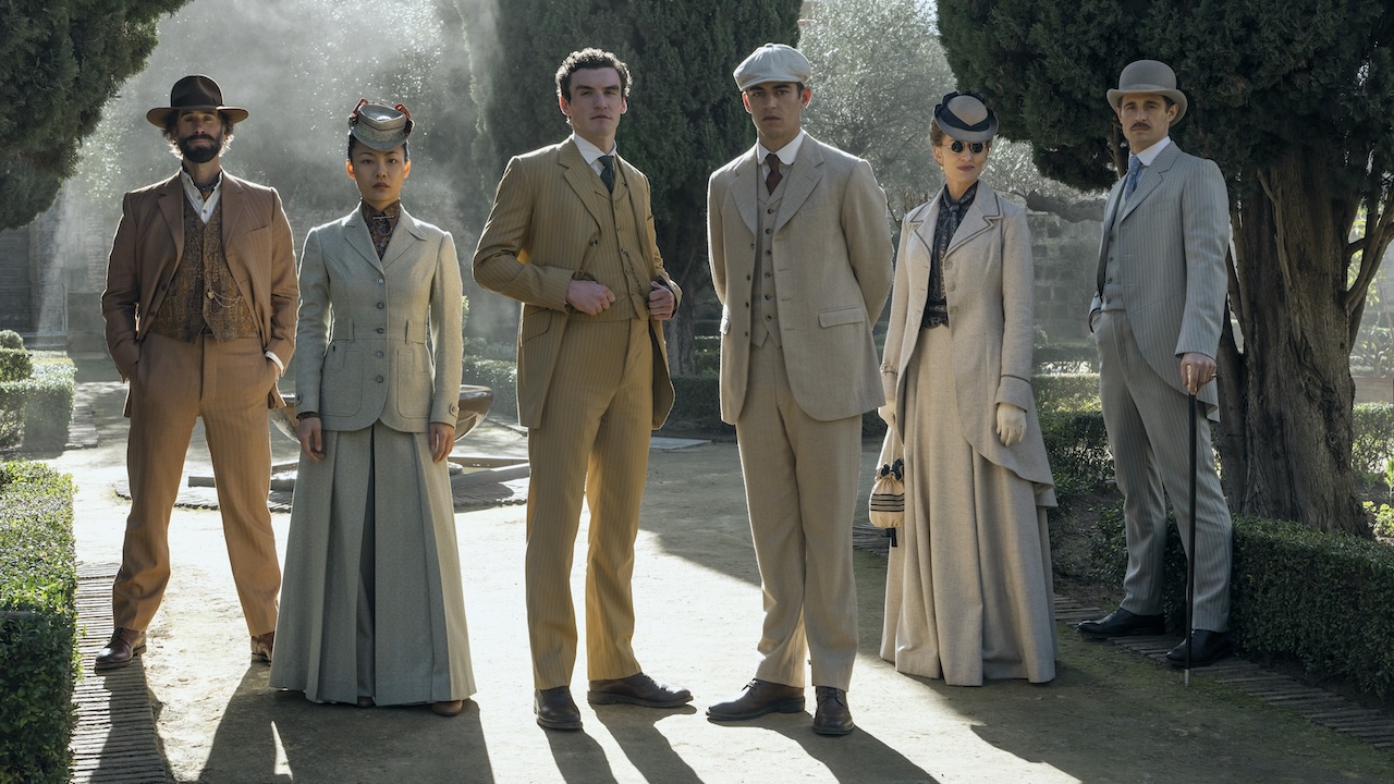 The cast of Young Sherlock standing outside in pale clothing in Amazon Prime's Young Sherlock