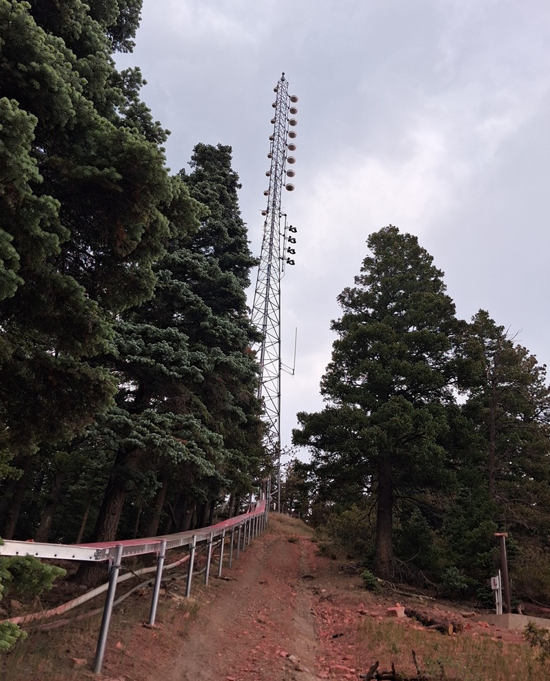 Radio tower at Camp Jackson. A view at the tower site from the back of the transmitter building. Red fire retardant is visible on the ground. Courtesy Michael Baldauf.