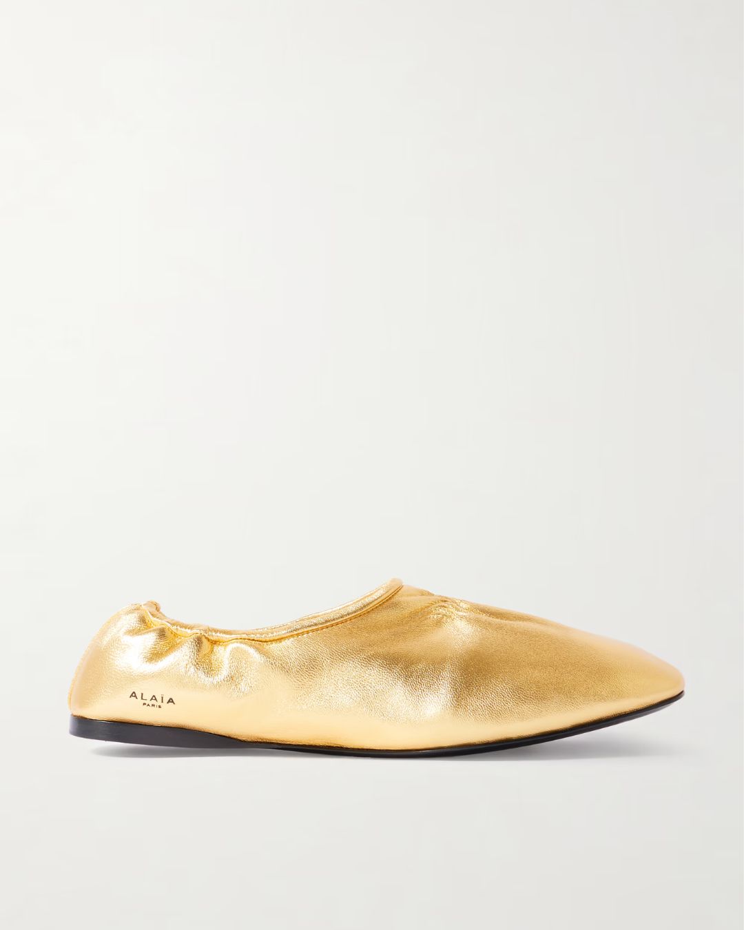 Alaia gold ballet pumps