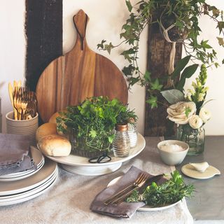 A tableware display with herbs