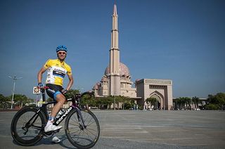 Tour leader David Zabriskie (Garmin Barracuda) relaxes prior to the start of stage two in front of a Putrajaya mosque.