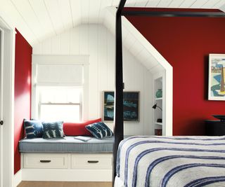 child's bedroom with built in window seat and storage shelves built into wall to side