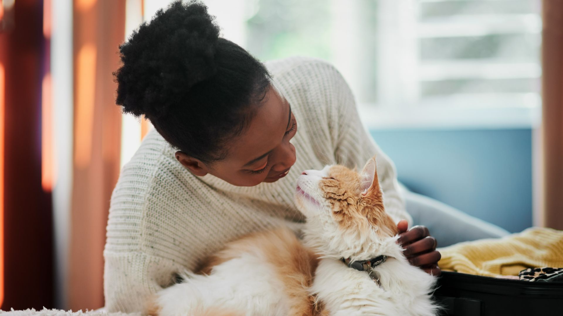 woman sitting with cat