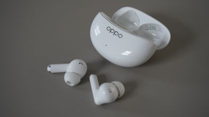 The Oppo Enco Air 3 Pro wireless earbuds on a grey background