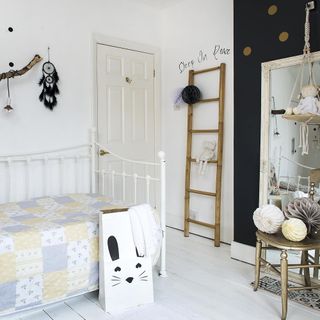 Monochromatic kids bedroom with wooden ladder and day bed