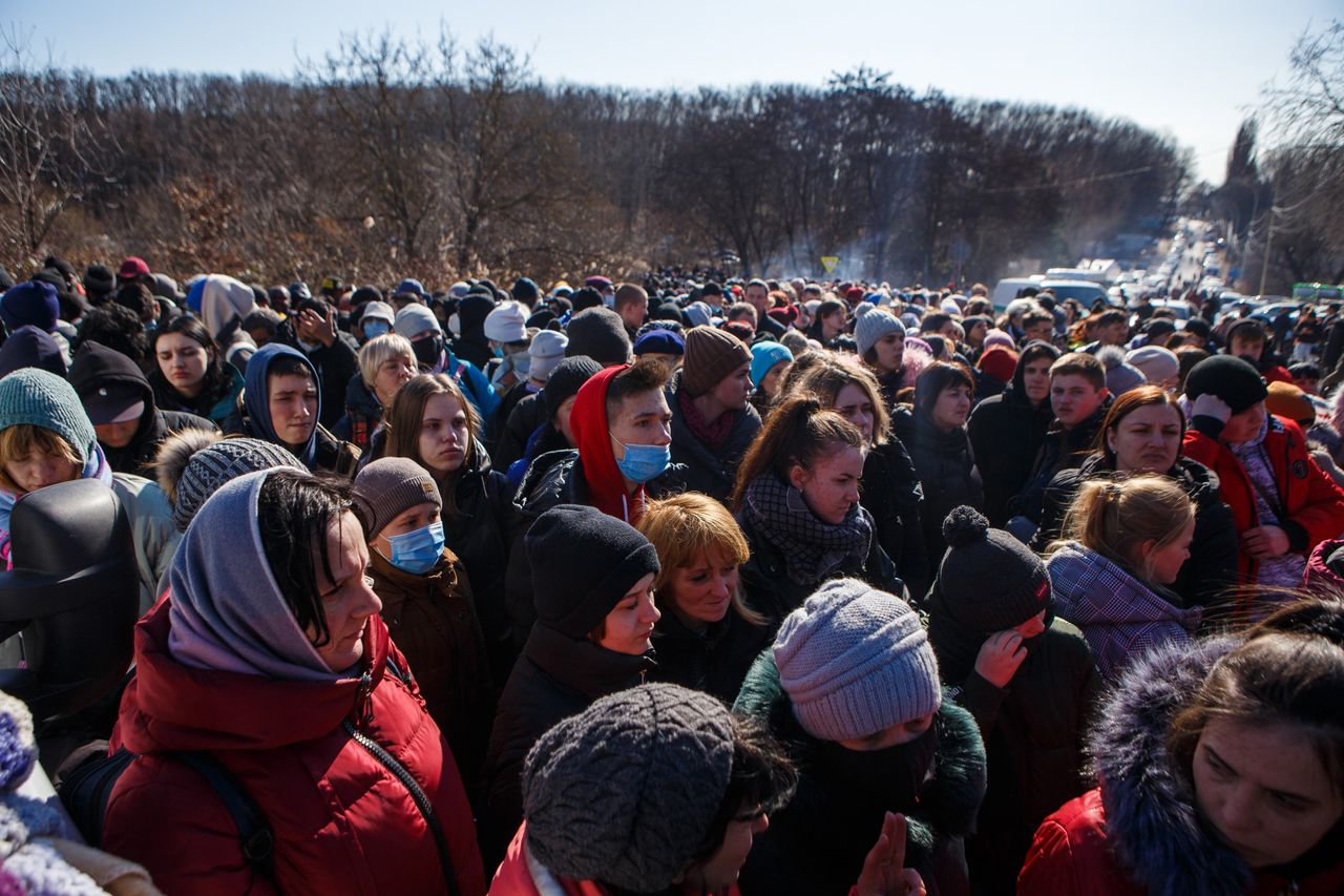 Crowd of refugees at a border checkpoint