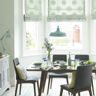 dining room with green patterned blinds