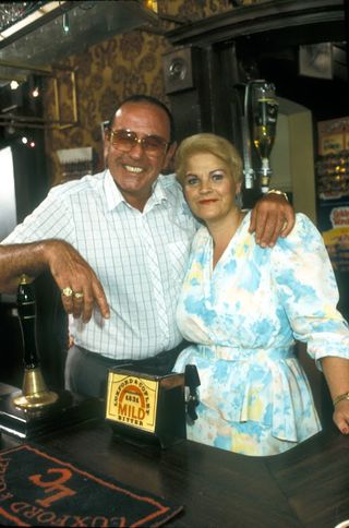 Frank and Pat behind the bar in The Vic in EastEnders