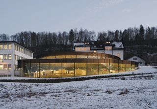 A glass spiralling museum in Switzerland in the winter snow