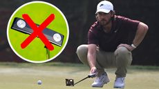Tommy Fleetwood lines up a putt with a blade putter crossed out