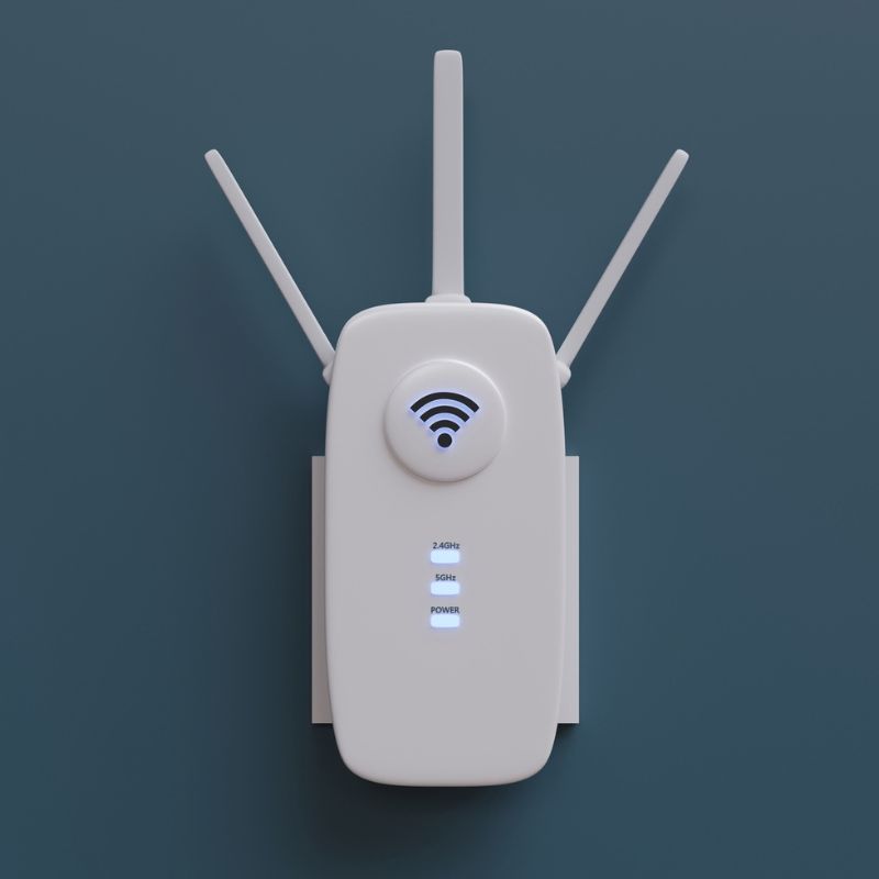 Wifi extender plugged into a green wall.