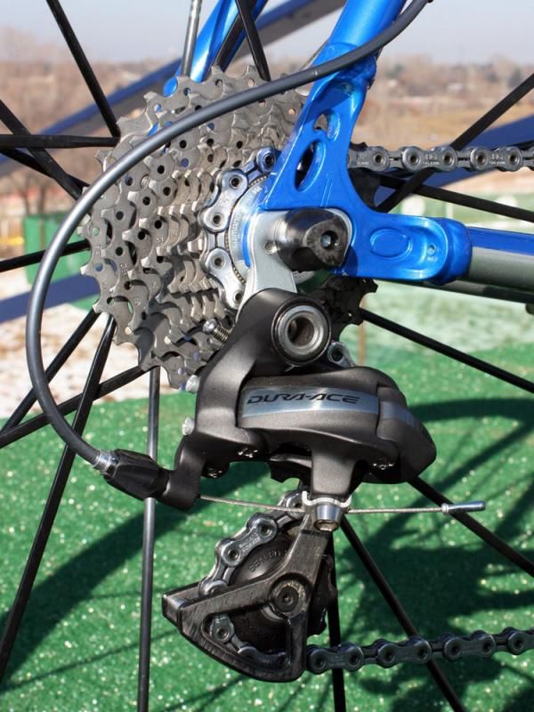 The Shimano Dura-Ace 7900 rear derailleur is bolted to a replaceable hanger.