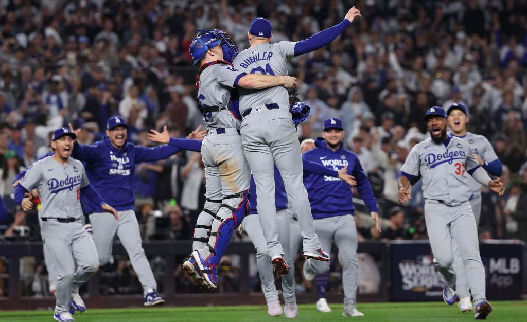 The Los Angeles Dodgers celebrate after defeating the New York Yankees in Game 5 to win the 2024 World Series. 