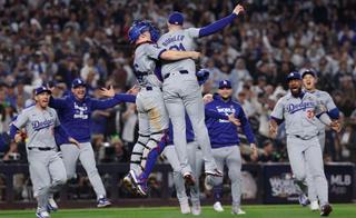 The Los Angeles Dodgers celebrate after defeating the New York Yankees in Game 5 to win the 2024 World Series. 