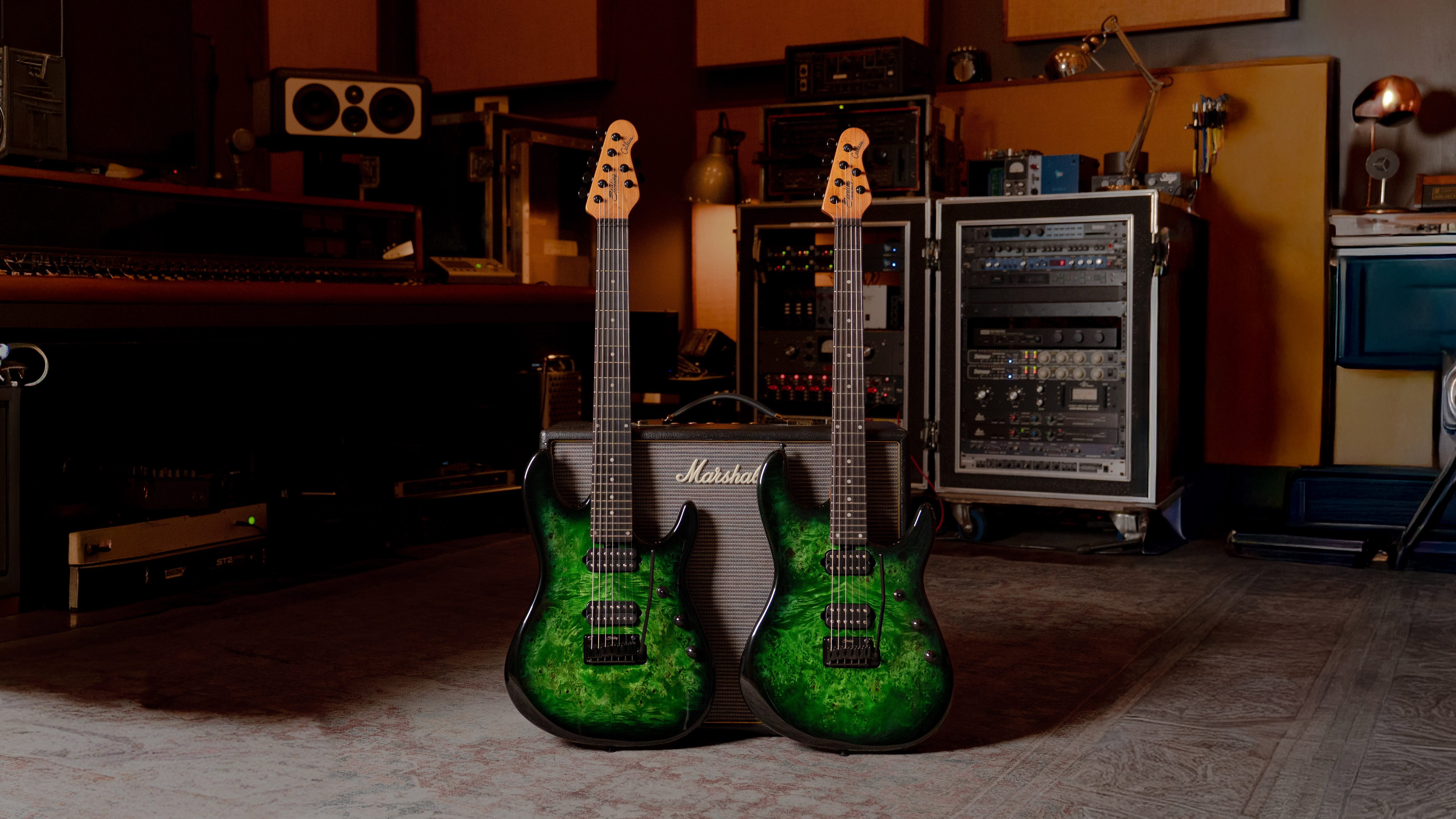 A press image of Jason Richardson's Artist Series Cutlass 6-string and 7-string signature guitars in bright green color standing upright against an amplifier in a music room