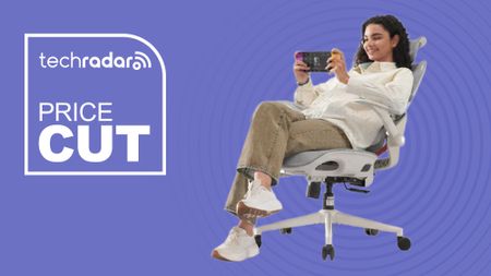 A lady sitting on the Sihoo B100 chair playing a video game, with a purple background and a TechRadar badge that reads 'Price Cut'