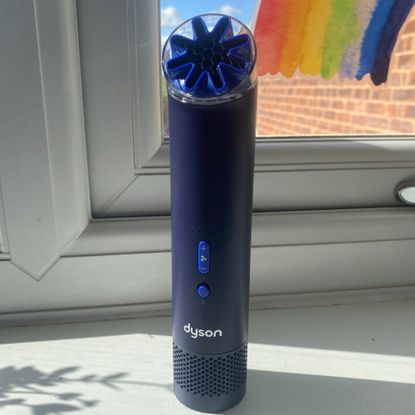 Dyson HushJet Mini Cool fan in Ink/Cobalt colour on my window cill in front of my kitchen window