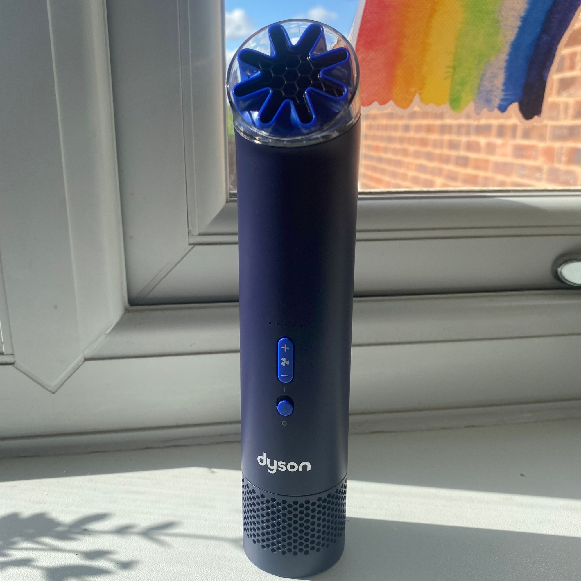 Dyson HushJet Mini Cool fan in Ink/Cobalt colour on my window cill in front of my kitchen window