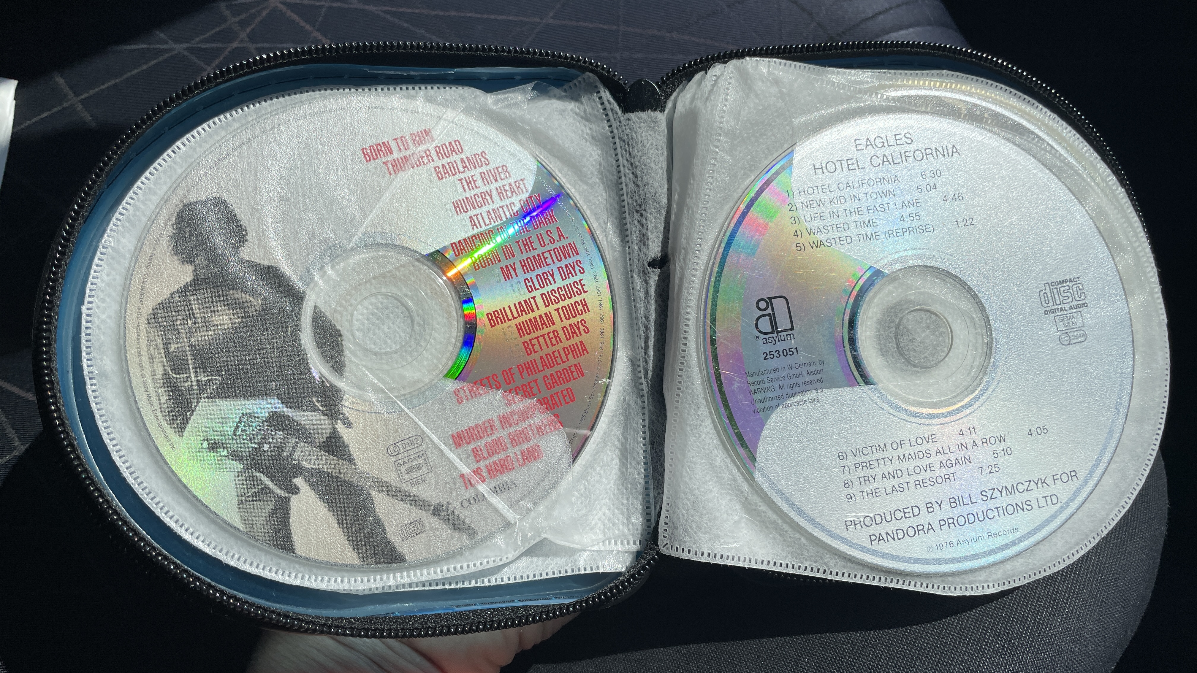 A car's CD player and burned CDs, on a hot day