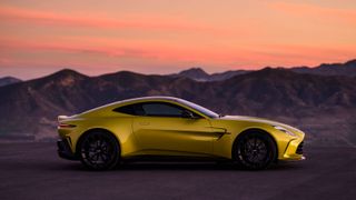 Aston Martin Vantage side on against sunset sky