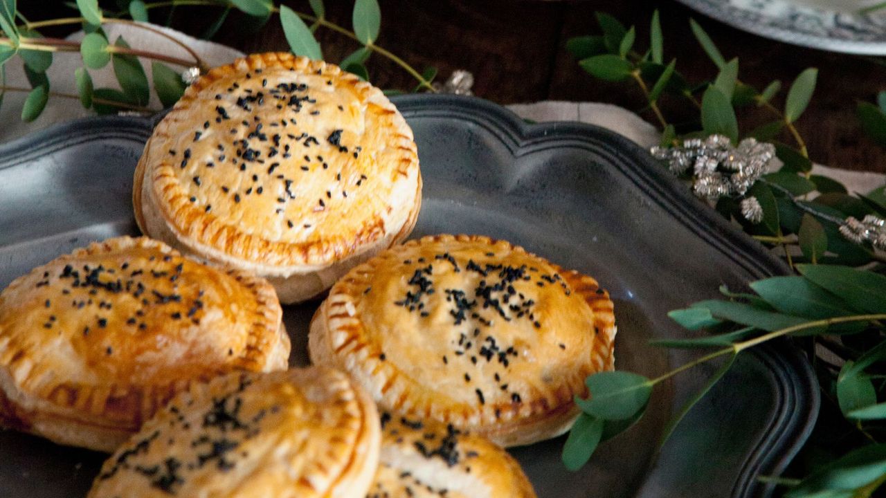 Mini pies on a tray with Christmas decorations