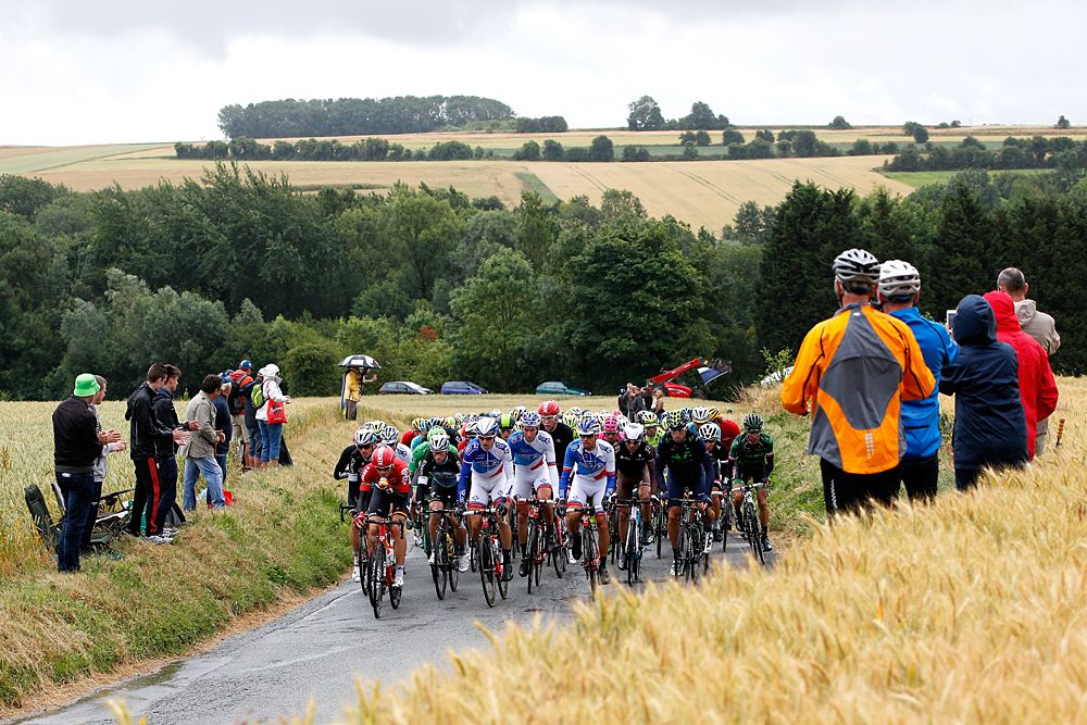 The Peloton bunches up after 12km following a crash