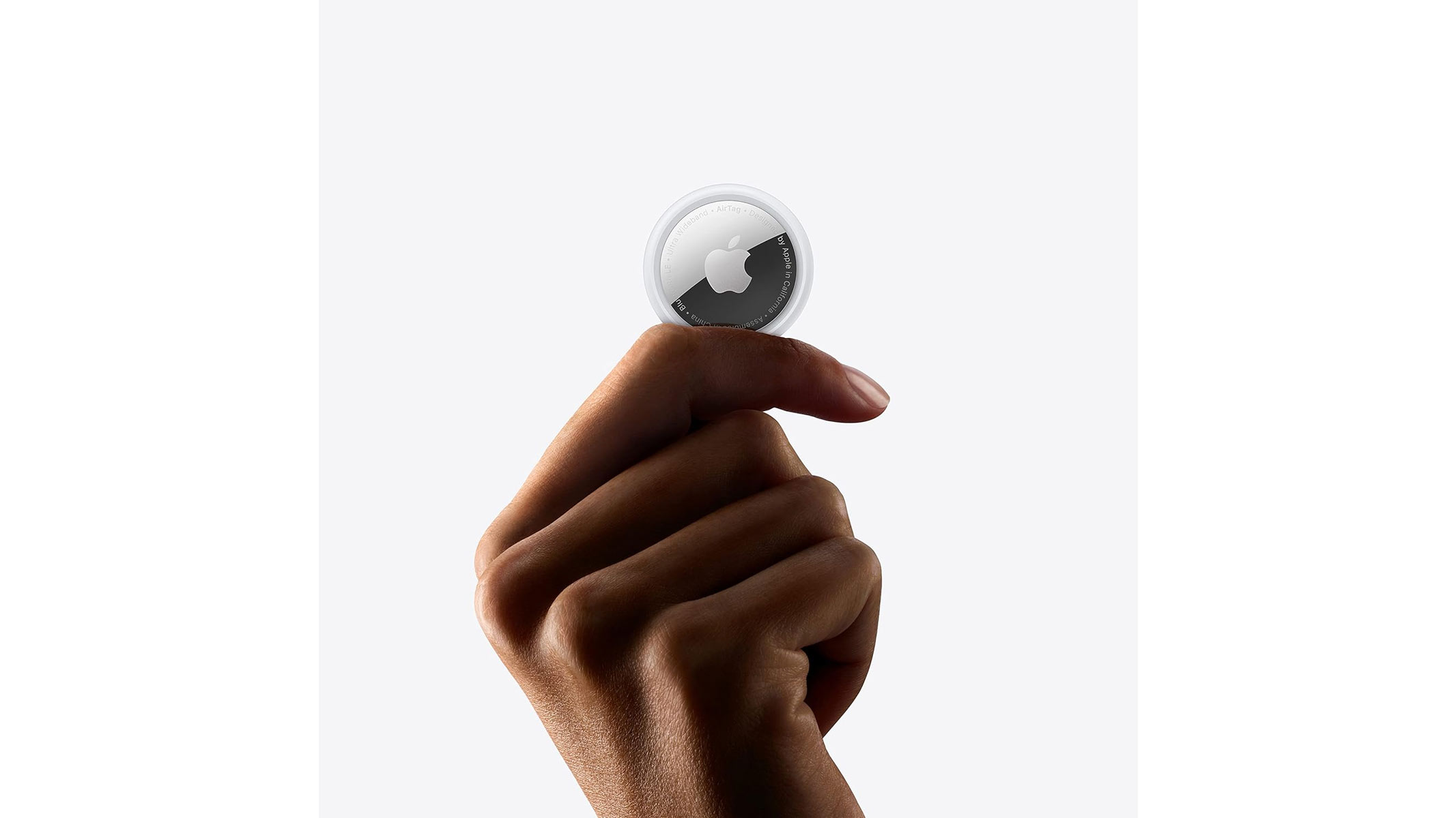 A small silver and black disk is shown against something else to highlight the scale and size of it, all on a white background.