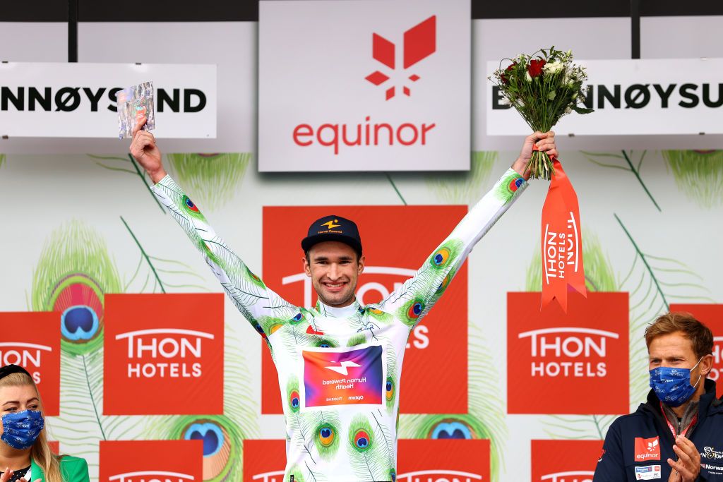 BRONNOYSUND NORWAY AUGUST 12 Stephen Bassett of United States and Team Human Powered Health Polka Dot Mountain Jersey celebrates at podium during the 9th Arctic Race Of Norway 2022 Stage 2 a 1543km stage from Mosjen to Brnnysund ArcticRace on August 12 2022 in Bronnoysund Norway Photo by Michael SteeleGetty Images
