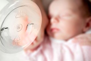 baby with plastic bottle