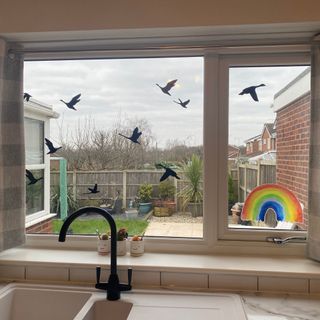 My kitchen window, complete with bird-deterring stickers