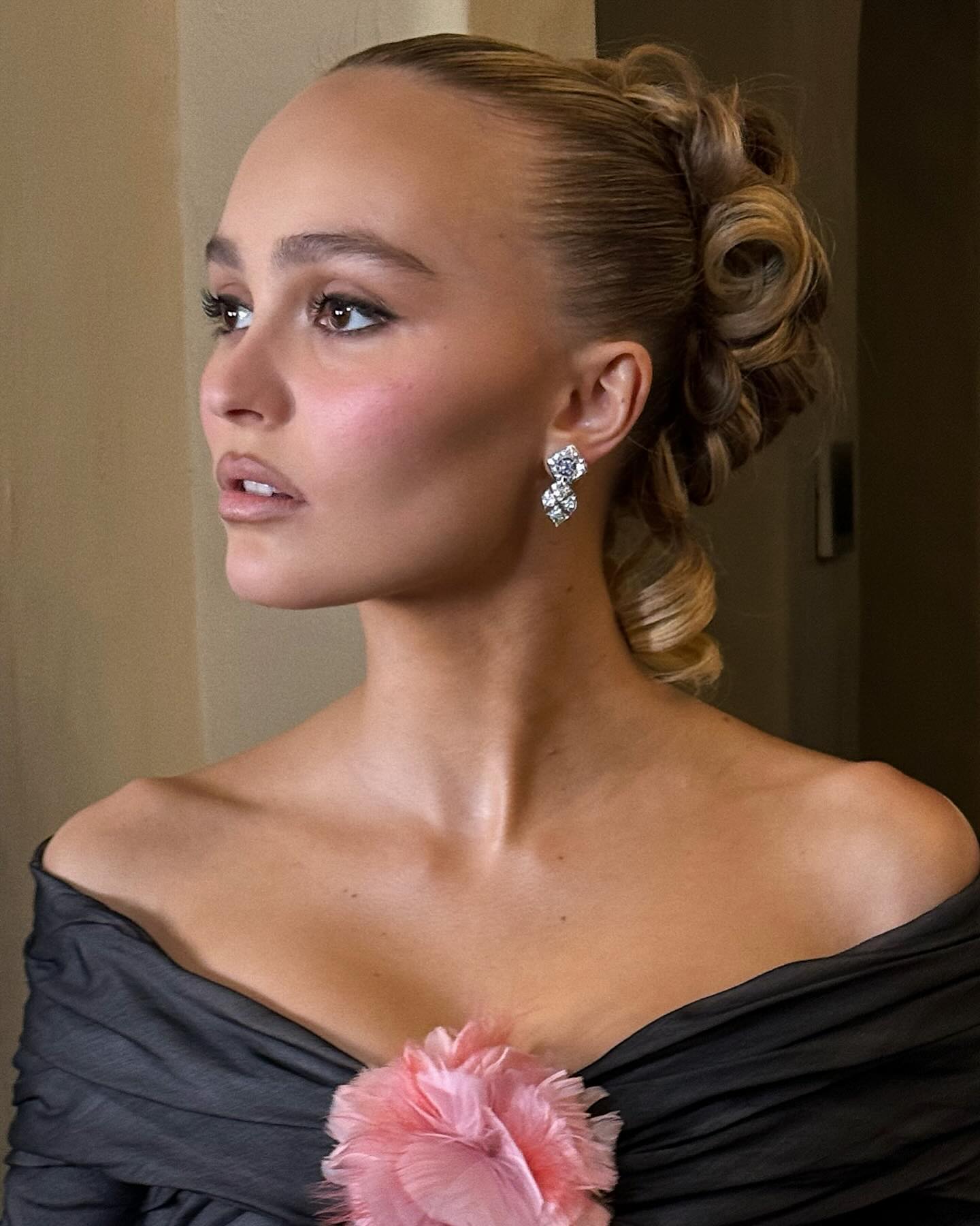 Lily Rose Depp with twisted curly hairstyle