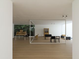 Room with wooden flooring and furnitures