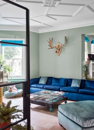 a living room with a blue sofa
