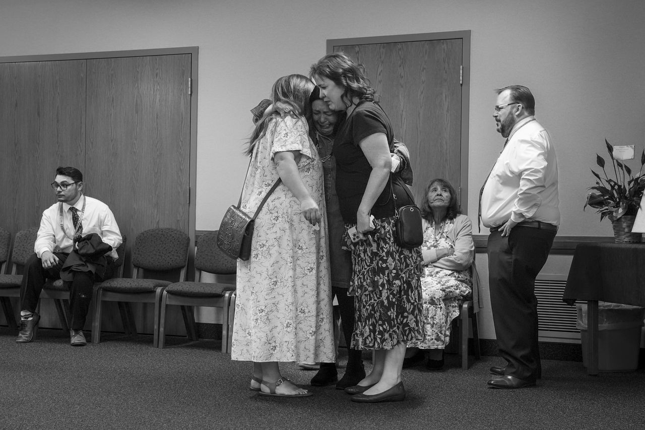 Kimberlee Martin, C, mother of Tanner Martin, is comforted by friends at the viewing of Tanner's body at The Church of Jesus Christ of Latter-day Saints on July 3, 2025, in American Fork, UT