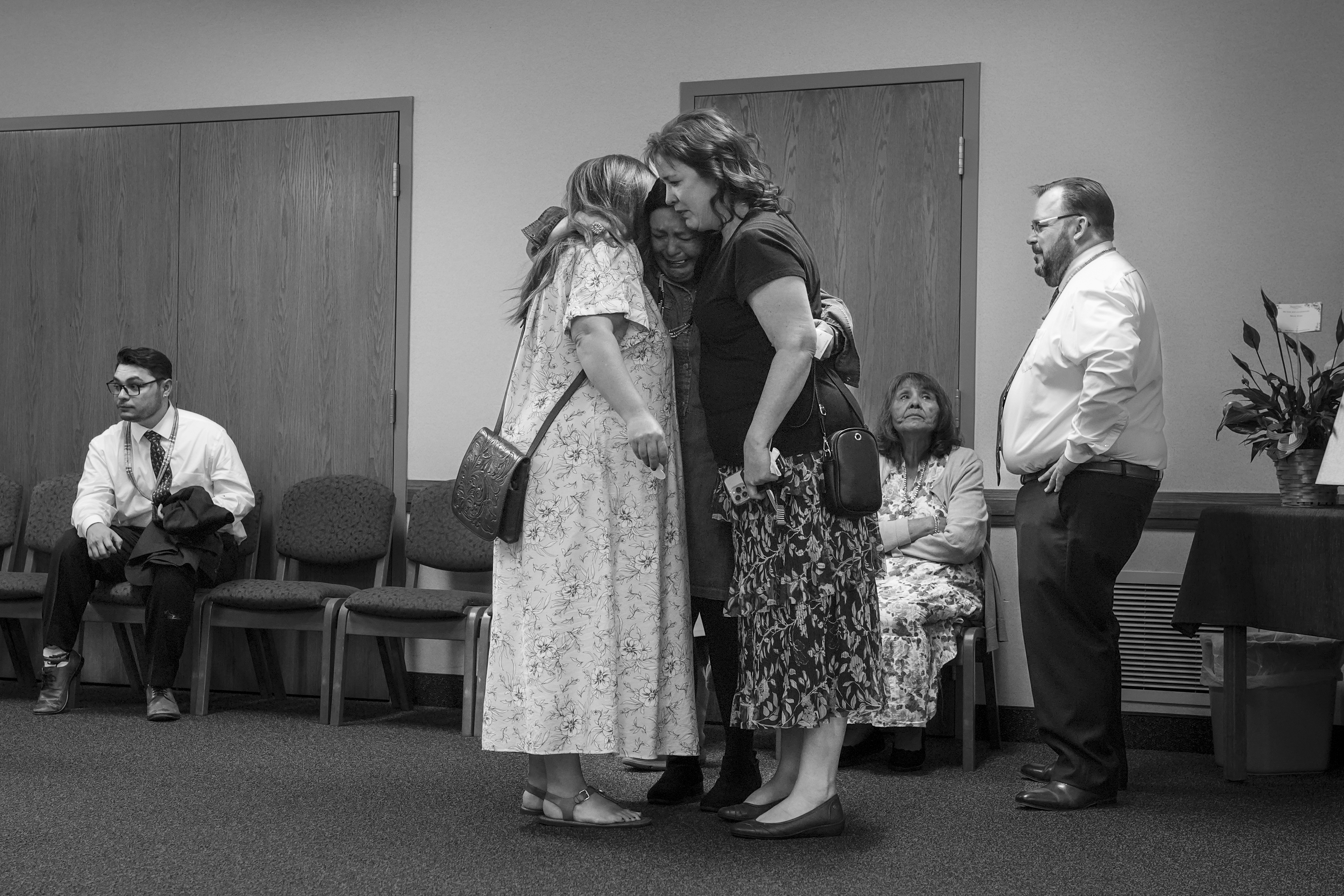 Kimberlee Martin, C, mother of Tanner Martin, is comforted by friends at the viewing of Tanner's body at The Church of Jesus Christ of Latter-day Saints on July 3, 2025, in American Fork, UT