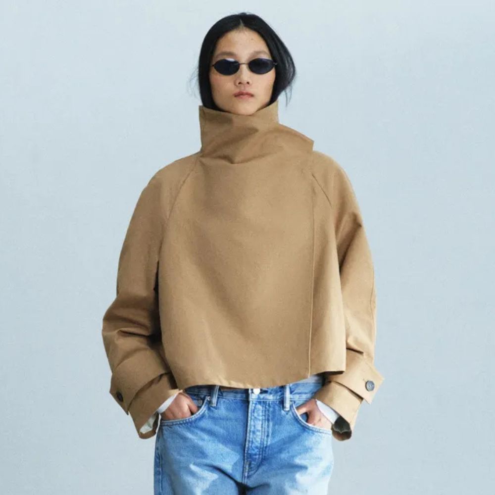 Model wears funnel-neck trench coat