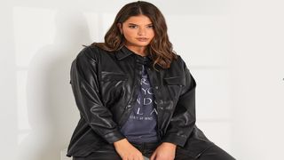 A woman wearing a pleather shirt and t-shirt